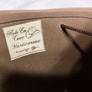 One of a kind, genuine Peruvian leather hat with hair.